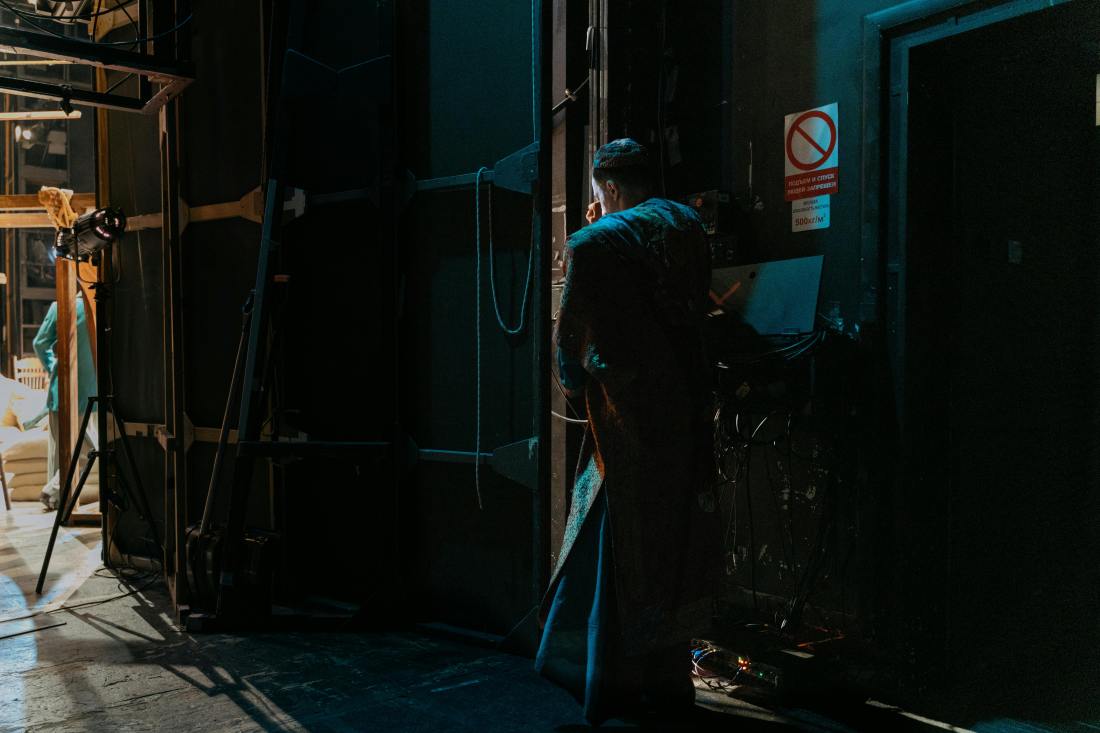 Photo by Elena Yunina: https://www.pexels.com/photo/person-standing-in-dark-room-8910207/