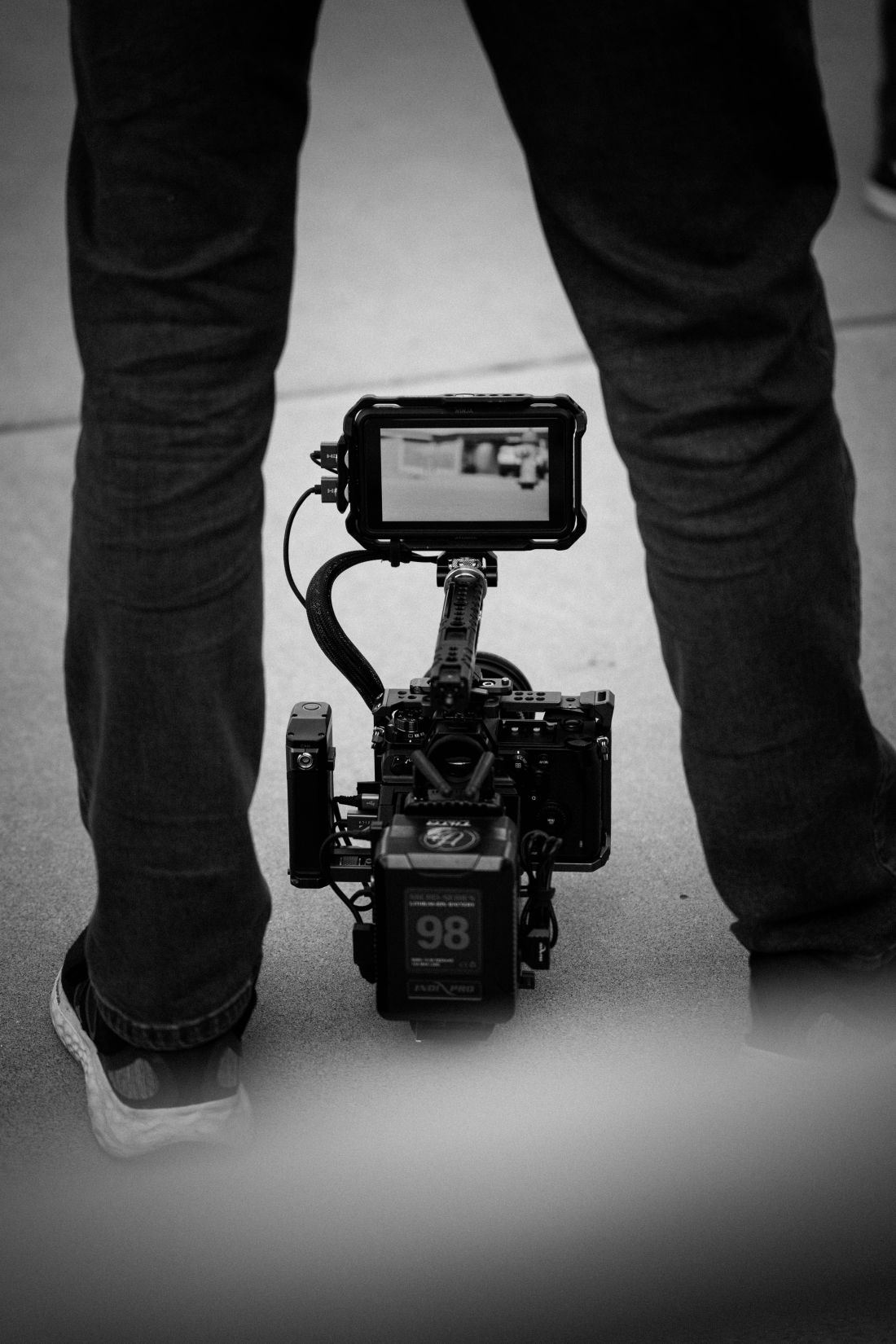 Photo by James Collington: https://www.pexels.com/photo/black-and-white-cinematic-camera-setup-outdoors-30697923/