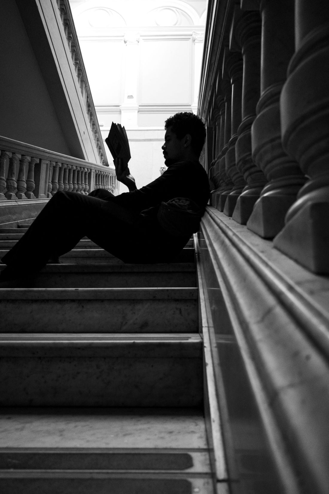 Photo by Alex Dos Santos: https://www.pexels.com/photo/silhouette-of-student-reading-on-classic-staircase-37826162/