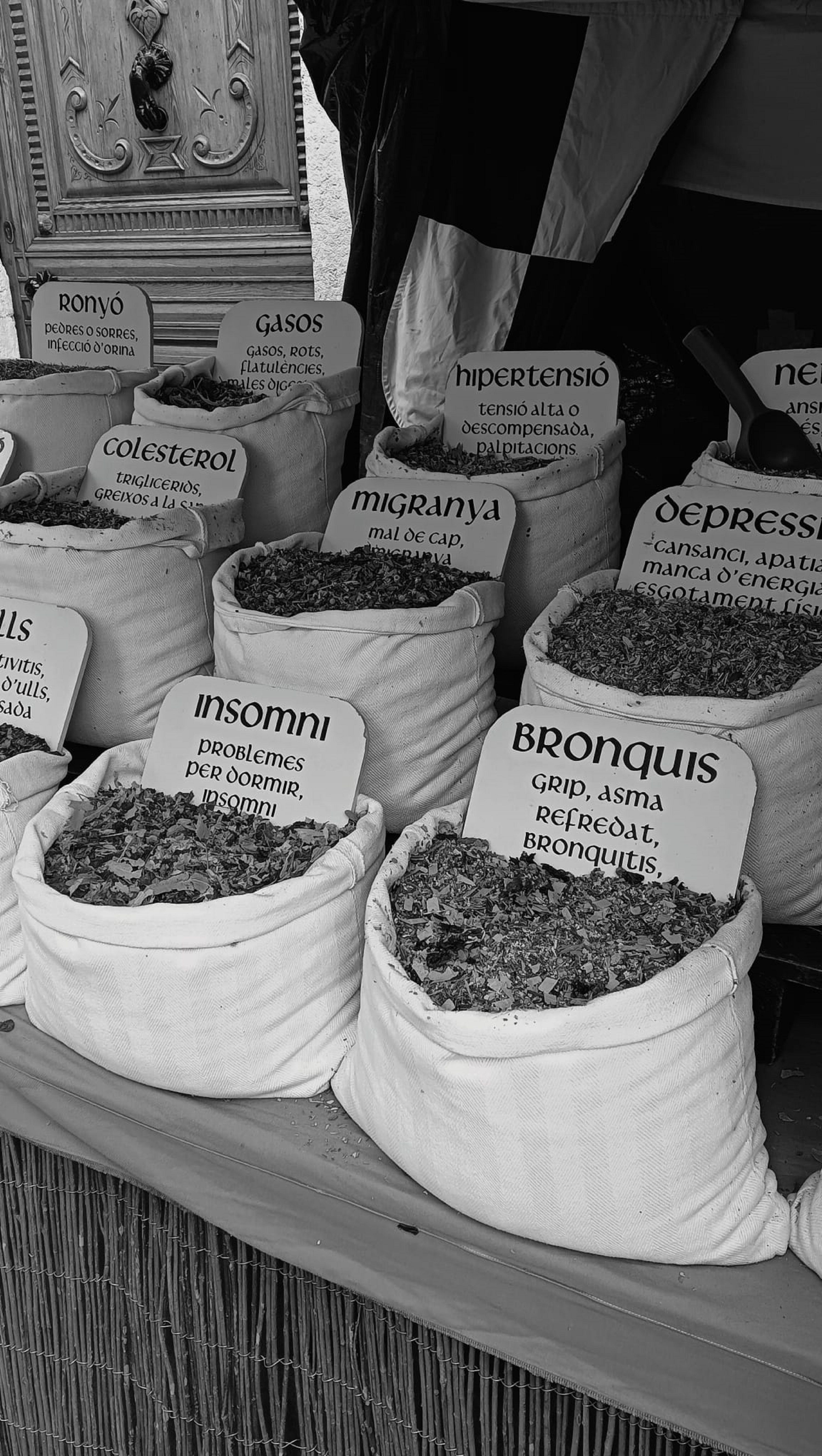 Photo by Júlia Isanta Muñoz: https://www.pexels.com/photo/black-and-white-photo-of-bags-of-herbs-at-a-market-24345843/