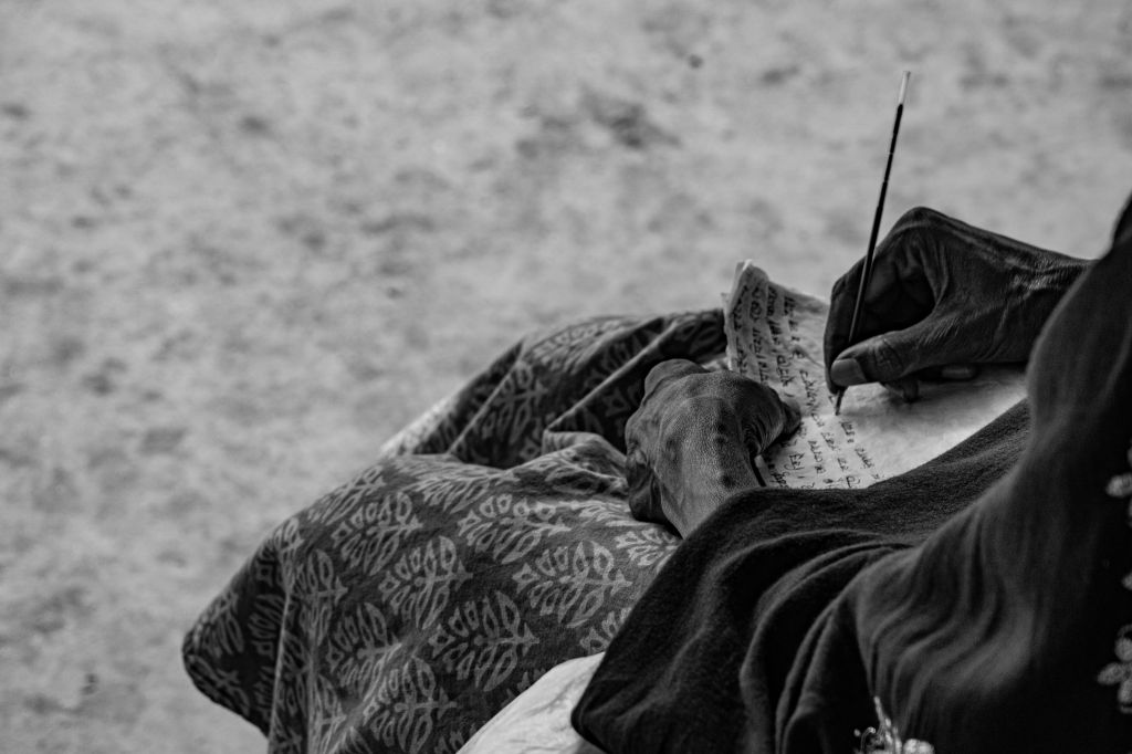 Photo by Bornil Sarker: https://www.pexels.com/photo/black-and-white-image-of-handwriting-in-progress-35088399/